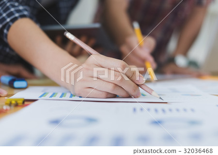 startup young successful team on meeting in modern office interior brainstorming, make a business plan, working on financial and marketing graph and chart 32036468