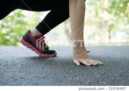 sportswoman athletic on starting point and ready for competition. Healthy young asian athlete woman ready for race in park. 32036497