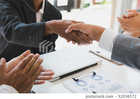 Business people shaking hands after finishing up a meeting. Businessman handshaking after conference. teamwork, partnership, collaboration, corporate concept. Business people shaking hands after finishing up a meeting. Businessman handshaking after conference. teamwork, partnership, collaboration, corporate concept. 32036572