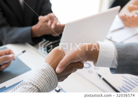 Business people shaking hands after finishing up a meeting. Businessman handshaking after conference. teamwork, partnership, collaboration, corporate concept. Business people shaking hands after finishing up a meeting. Businessman handshaking after conference. teamwork, partnership, collaboration, corporate concept. 32036574