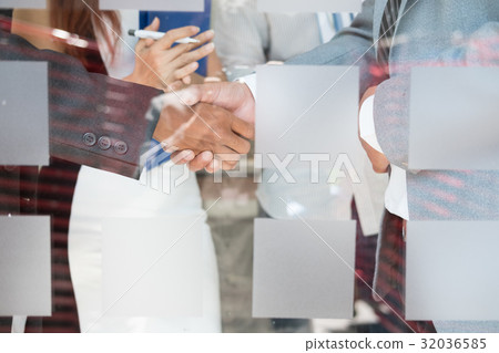 Business people shaking hands after finishing up a meeting. Businessman handshaking after conference. teamwork, partnership, collaboration, corporate concept. Business people shaking hands after finishing up a meeting. Businessman handshaking after conference. teamwork, partnership, collaboration, corporate concept. 32036585