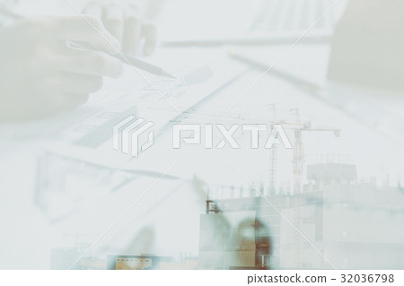 Architect working on real estate project at workplace. Male engineer hand working with living house blueprint at office. Business, people, construction and building concept double exposure with crane 32036798