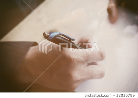 man writing on paper document in office. Businessman or job seeker signing on contract or application form double exposure with chess 32036799