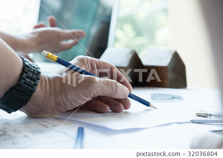 Architect working on real estate project with partner at workplace. Male engineer hand discussing with colleague on living house blueprint at office. Business, people, construction and building concept 32036804
