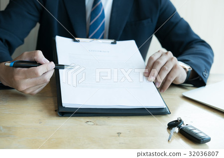 businessman present signing sales contract with car key to customer at office. ownership, customer buying and salesman selling transportation concept. businessman present signing sales contract with car key to customer at office. ownership, customer buying and salesman selling transportation concept. 32036807
