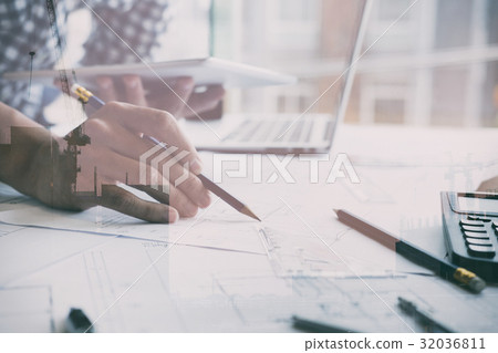 Architect working on real estate project at workplace. Male engineer hand working with digital tablet and living house blueprint at office. Business, people, construction and building concept double exposure with crane 32036811