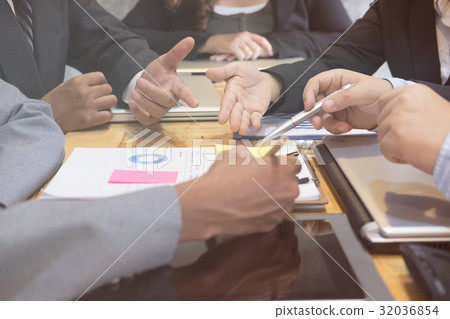 young business people having a meeting in office. businessman and businesswoman working at workplace. Conference, discussion, teamwork, collaboration, corporate concept. young business people having a meeting in office. businessman and businesswoman working at workplace. Conference, discussion, teamwork, collaboration, corporate concept. 32036854