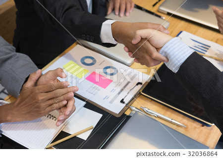 Business people shaking hands after finishing up a meeting. Businessman handshaking after conference. teamwork, partnership, collaboration, corporate concept. Business people shaking hands after finishing up a meeting. Businessman handshaking after conference. teamwork, partnership, collaboration, corporate concept. 32036864