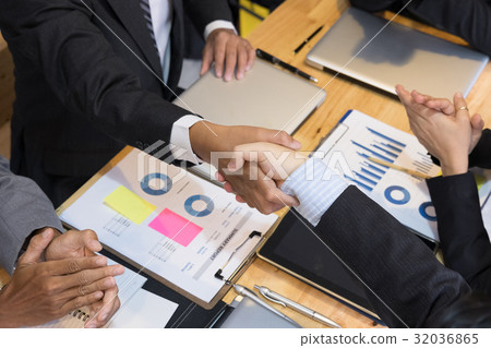 Business people shaking hands after finishing up a meeting. Businessman handshaking after conference. teamwork, partnership, collaboration, corporate concept. Business people shaking hands after finishing up a meeting. Businessman handshaking after conference. teamwork, partnership, collaboration, corporate concept. 32036865