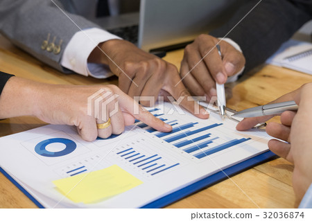 young business people having a meeting in office. businessman and businesswoman working at workplace. Conference, discussion, teamwork, collaboration, corporate concept. young business people having a meeting in office. businessman and businesswoman working at workplace. Conference, discussion, teamwork, collaboration, corporate concept. 32036874