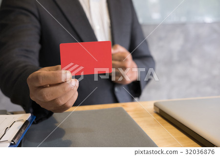 business man holding a credit card for online shopping, purchase goods from internet, make payment on bank website 32036876