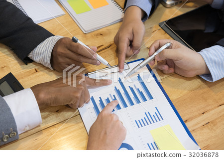 young business people having a meeting in office. businessman and businesswoman working at workplace. Conference, discussion, teamwork, collaboration, corporate concept. young business people having a meeting in office. businessman and businesswoman working at workplace. Conference, discussion, teamwork, collaboration, corporate concept. 32036878