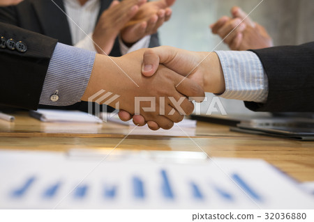 Business people shaking hands after finishing up a meeting. Businessman handshaking after conference. teamwork, partnership, collaboration, corporate concept. Business people shaking hands after finishing up a meeting. Businessman handshaking after conference. teamwork, partnership, collaboration, corporate concept. 32036880