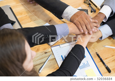young businessman joining hand, team of business people touching hands together - unity, harmony, teamwork, partnership, collaboration, corporate concept. 32036884