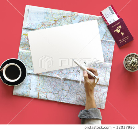 Hand holding toy airplane and planning travel destination Hand holding toy airplane and planning travel destination 32037986