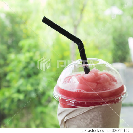 Closeup of watermelon smoothie in plastic glass 32041302
