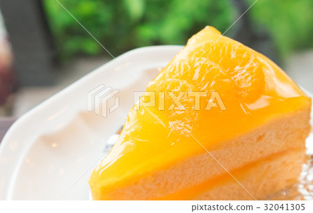 Closeup orange cake on wood table 32041305
