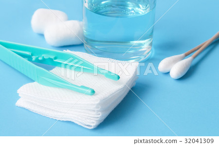 Closeup set of wound dressing on blue background 32041309
