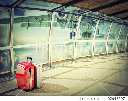 stack of traveling luggage in airport terminal 32042397