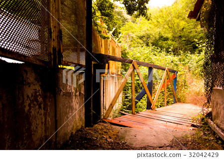 Rustic wooden bridge at sunny day 32042429