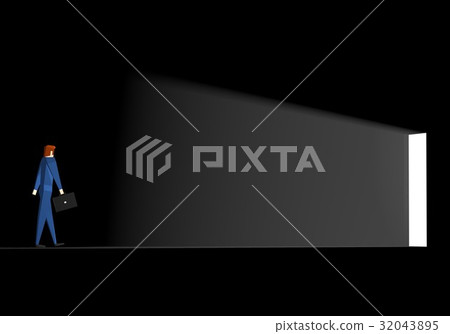 A businessman walking towards the exit in the dark 32043895