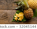 pineapple fruit cut on green leaf 32045144