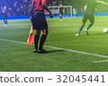 Lineman referee with flag Officiate soccer game 32045441
