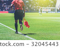 Lineman referee with flag Officiate soccer game 32045443