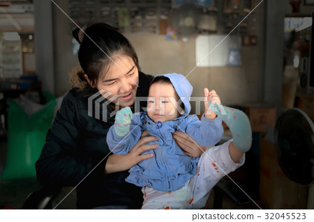 baby is playing with her mom baby is playing with her mom 32045523