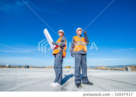 two engineers at airport runway two engineers at airport runway 32047417