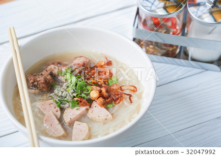 Vietnamese noodle soup on white wooden table. Vietnamese noodle soup on white wooden table. 32047992