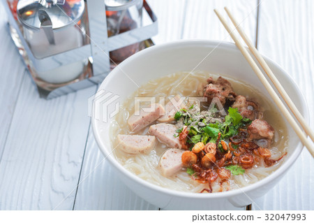 Vietnamese noodle soup on white wooden table. 32047993