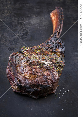 Tomahawk Steak on old Metall Sheet 32048828