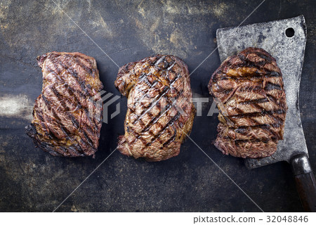 Barbecue Rib-Eye Steak on old Metall Sheet 32048846