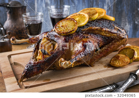 Roast Goose with Orange slices on Cutting Board Roast Goose with Orange slices on Cutting Board 32049365