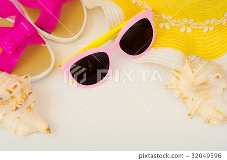 Beach accessories and sea shells. Female hat 32049596
