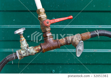 Connection hoses, old rusty plumbing valves 32051361