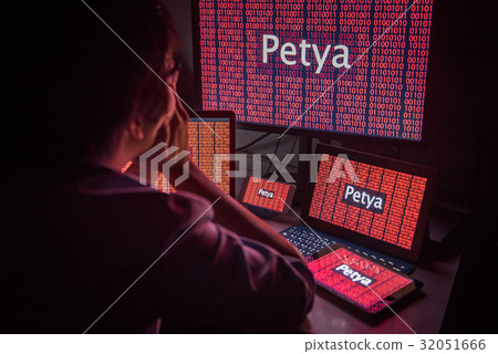 Young Asian male frustrated by Petrwrap ransomware attack 32051666