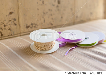 Rolls with pastel color ribbons and lace Rolls with pastel color ribbons and lace 32051898