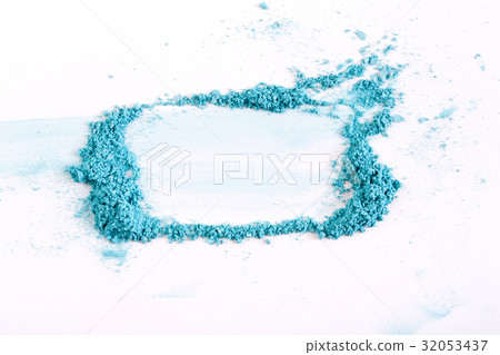 Makeup background with blue eyeshadow sprinkled on 32053437