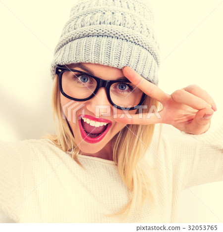 Young woman taking a selfie 32053765