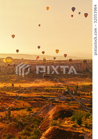 Balloons in gentle soft light over Cappadocia Balloons in gentle soft light over Cappadocia 32053964