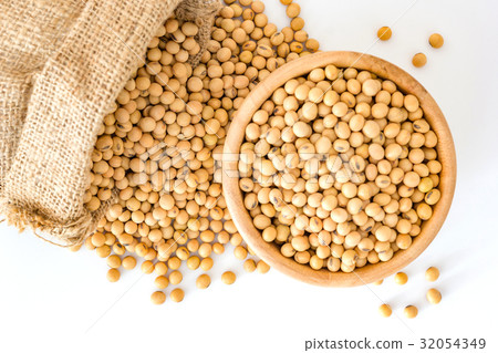 Soybeans in a wooden bowl on a white background. 32054349