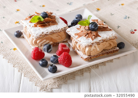 sliced chocolate cake with raspberries 32055490