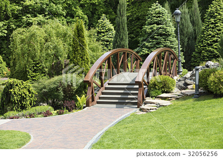 Wooden bridge over the stream is landscape design 32056256