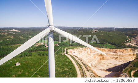 Beautiful aerial close-up view of windmills on the Beautiful aerial close-up view of windmills on the 32060657