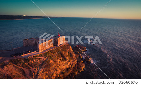 Aerial view of ocean and Nazare lighthouse at 32060670