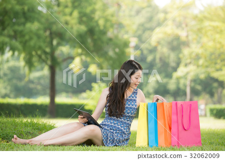 asian woman using digital tablet shopping asian woman using digital tablet shopping 32062009