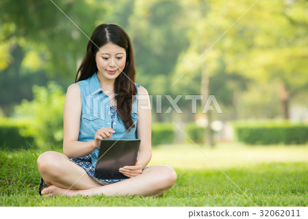 asian woman using digital tablet shopping 32062011