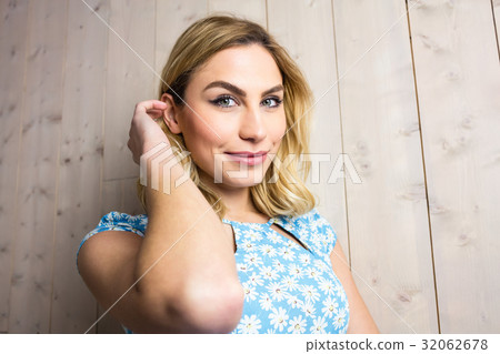 Portrait of smiling woman posing against texture background Portrait of smiling woman posing against texture background 32062678